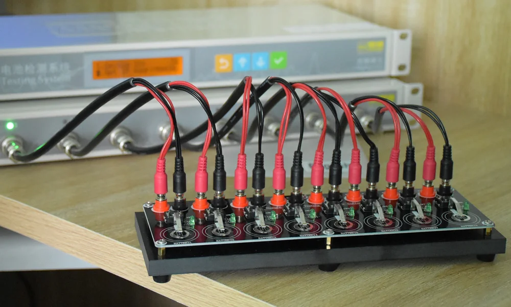 TOB-BC-8 connected to a TOB coin cell tester with 4-pin bayonet test cables