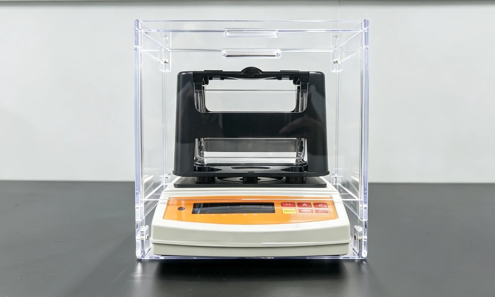 TOB-AR-600G solid density tester inside its clear wind and dust shield